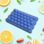 Close-up of the Lollipop Candy Maker's mold, showing candy forming process.