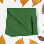 Hajj travel bag with essentials like a prayer mat and pouch, packed for convenience.