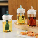 Two-in-one glass oil dispenser and brush bottle, perfect for kitchen cooking.