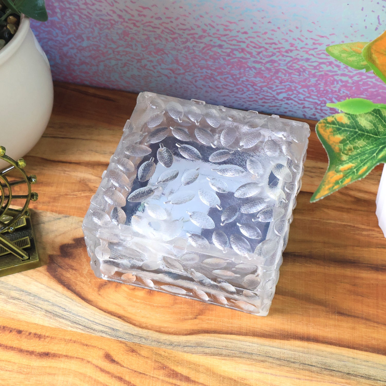 Ice cube solar lamps used as decorative outdoor lighting around a patio area.