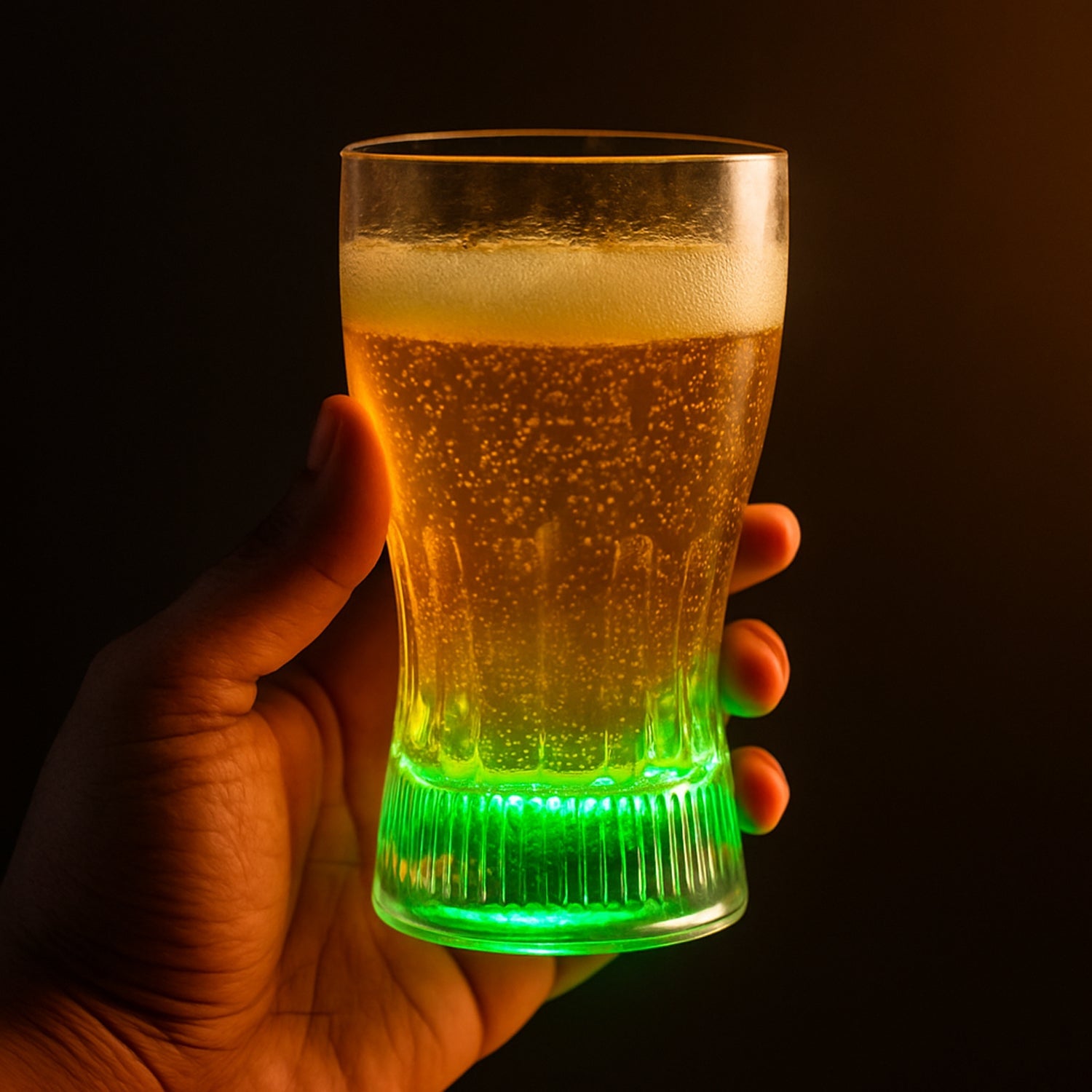 Hand holding an acrylic LED Light Glass glowing bright blue with color changing LEDs.