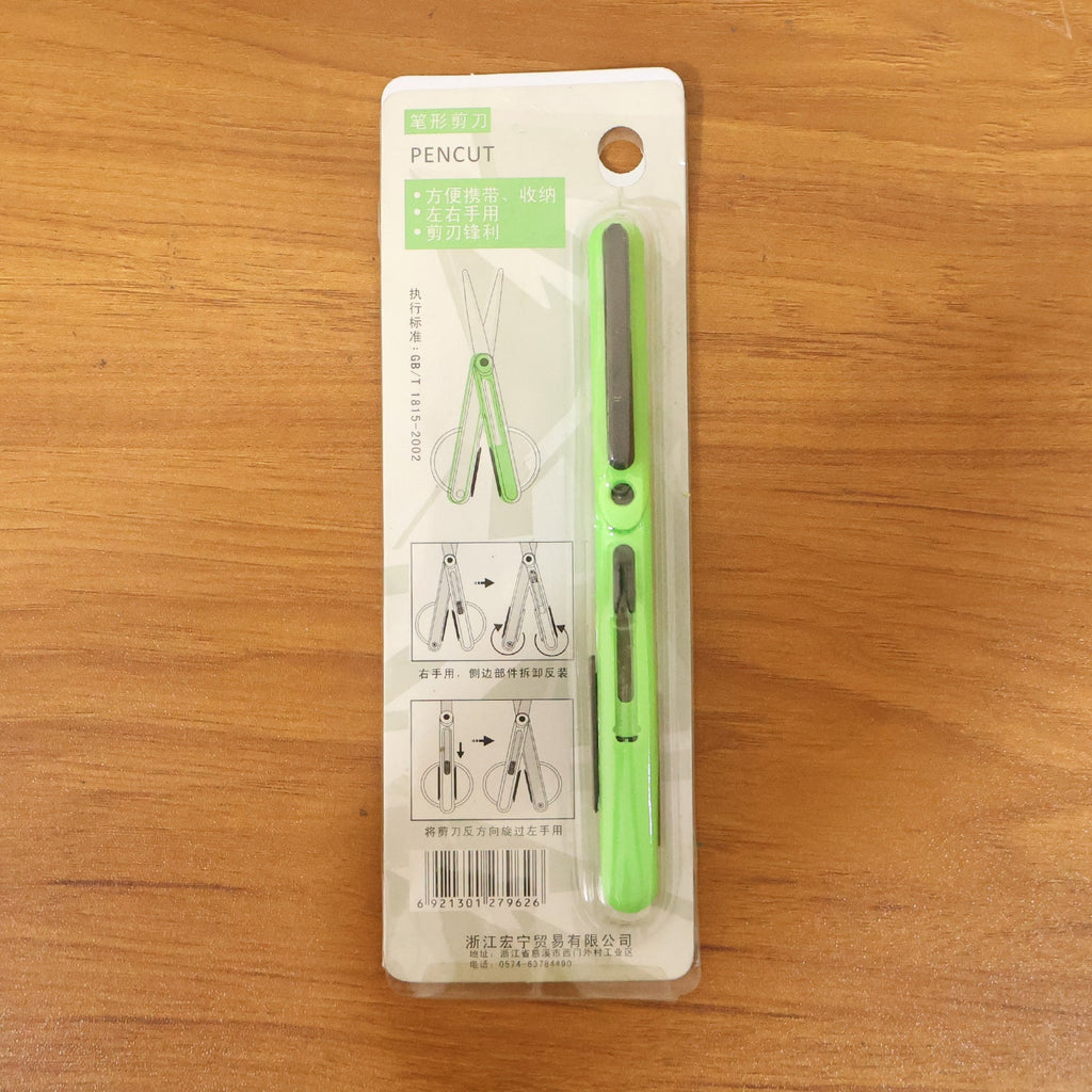 Pen-style compact scissors from FERVENT with the convenient clip attached.