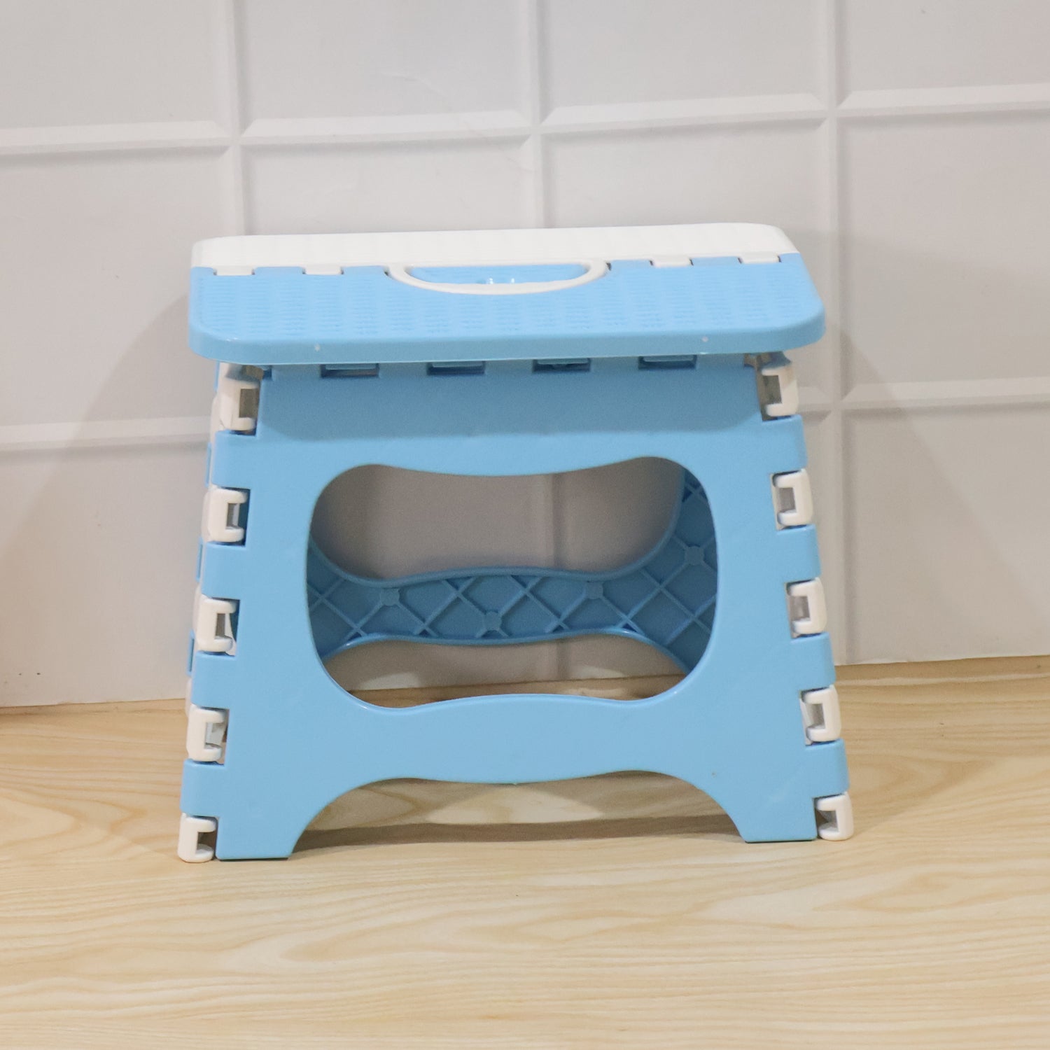 Top surface of a plastic utility stool