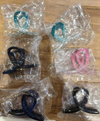 Assorted plastic hair clamps with matte textured finish