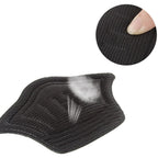 Close-up of the textured, self-adhesive backing of a Heel Cushion Pad before application, ensuring secure placement.