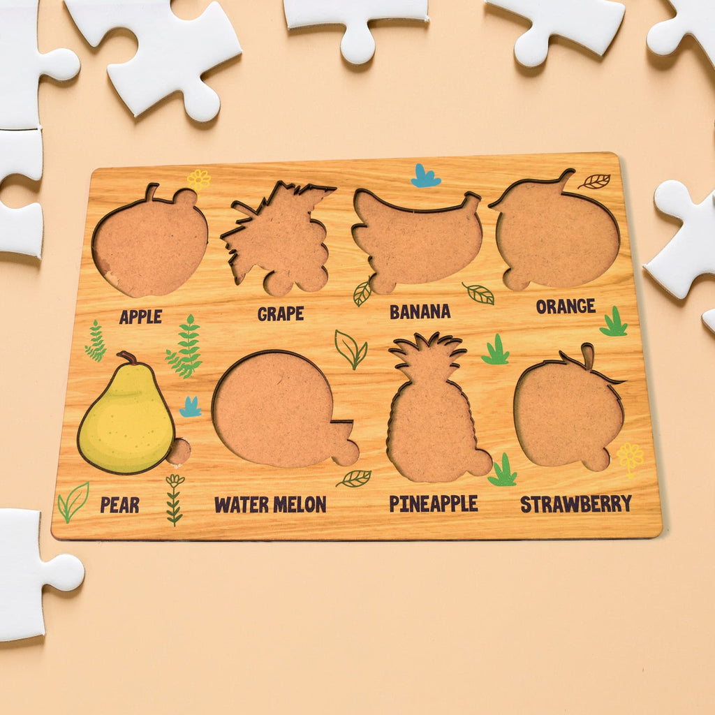 Child happily engaging with the wooden fruit learning board, developing motor skills.