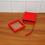Transparent jewellery display case showing floating design and elegant black frame