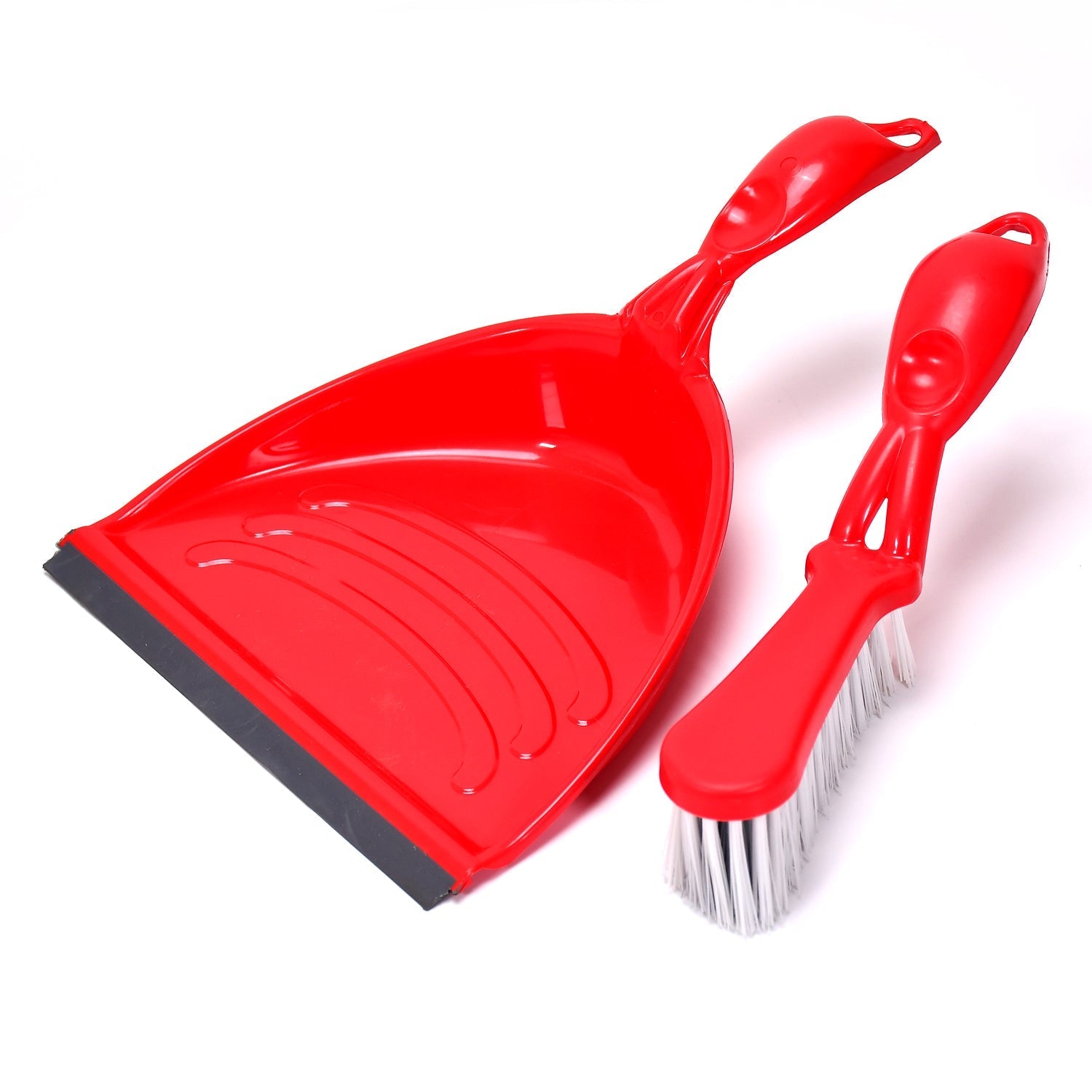 Long-handle dustpan set in use, efficiently collecting dust from the floor.