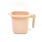 A clean white Plastic Bath Mug, perfect for a modern bathroom aesthetic.