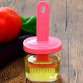Durable plastic spatula with holder for versatile cooking tasks.