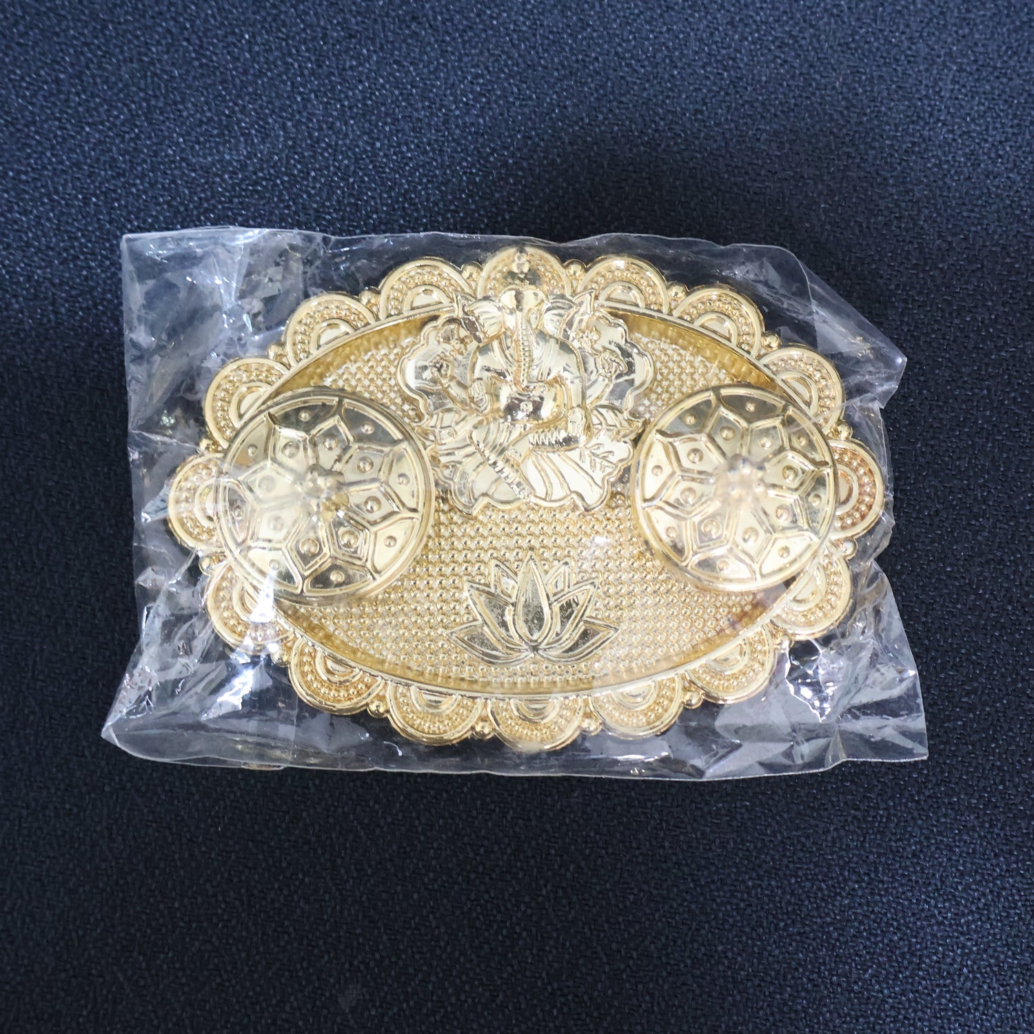 Ganesh embossed kumkum chopra showcasing delicate embossing and durable metal alloy material
