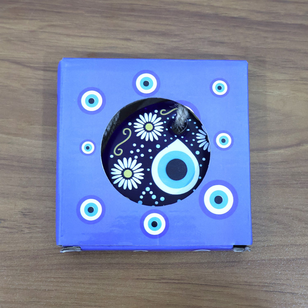 Evil Eye Wall Hanging displayed against rustic wooden background emphasizing cultural charm