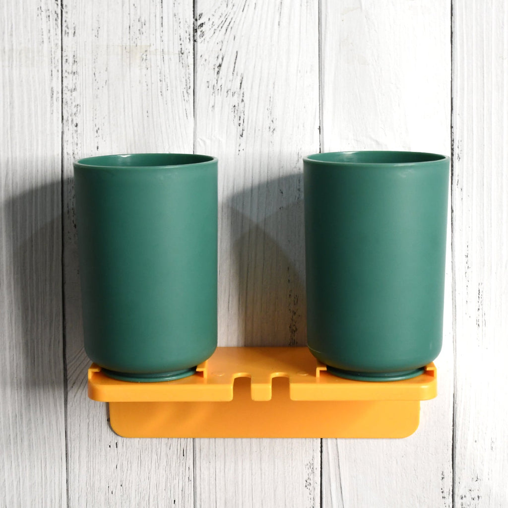 Multipurpose wall mount toothbrush holder with two blue cups for hygienic bathroom storage.
