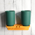 Multipurpose wall mount toothbrush holder with two blue cups for hygienic bathroom storage.