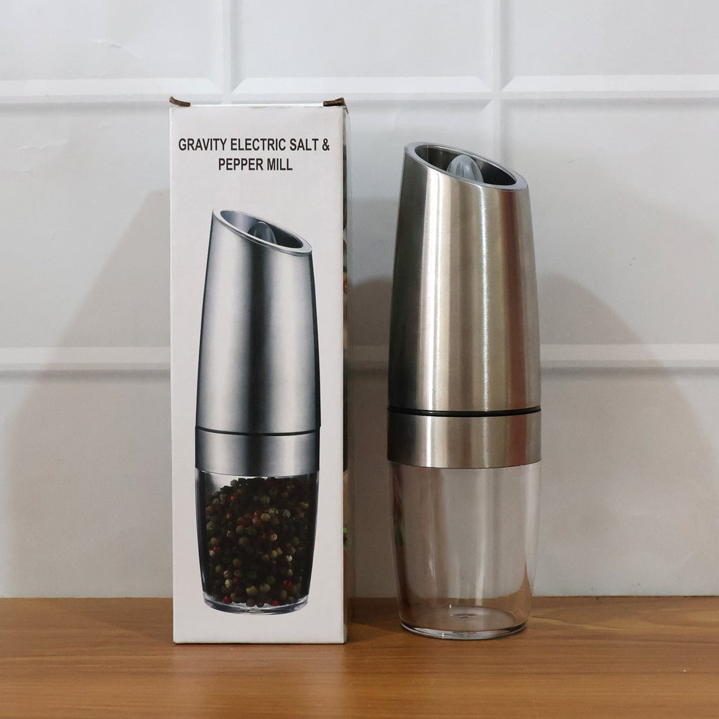 Stylish automatic gravity grinder with LED light illuminating seasoning area