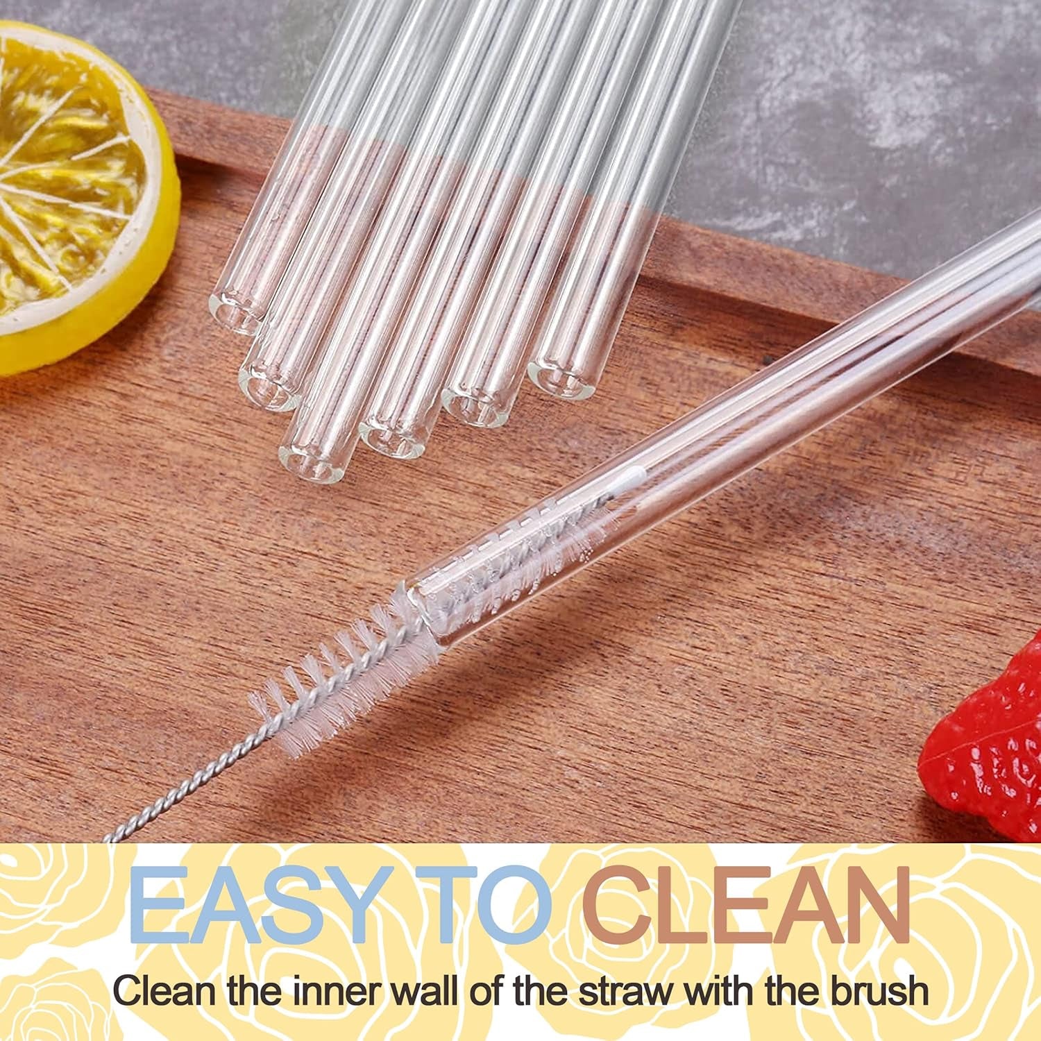 Transparent reusable glass straws arranged on a wooden surface