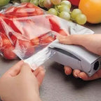Mini portable plastic bag sealer efficiently seals food packets for freshness.
