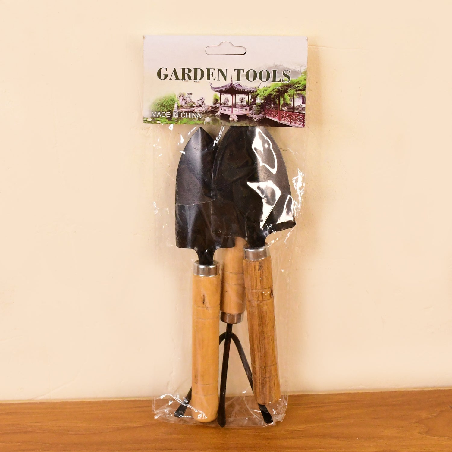 Garden tool set image showing wooden handles and metal heads