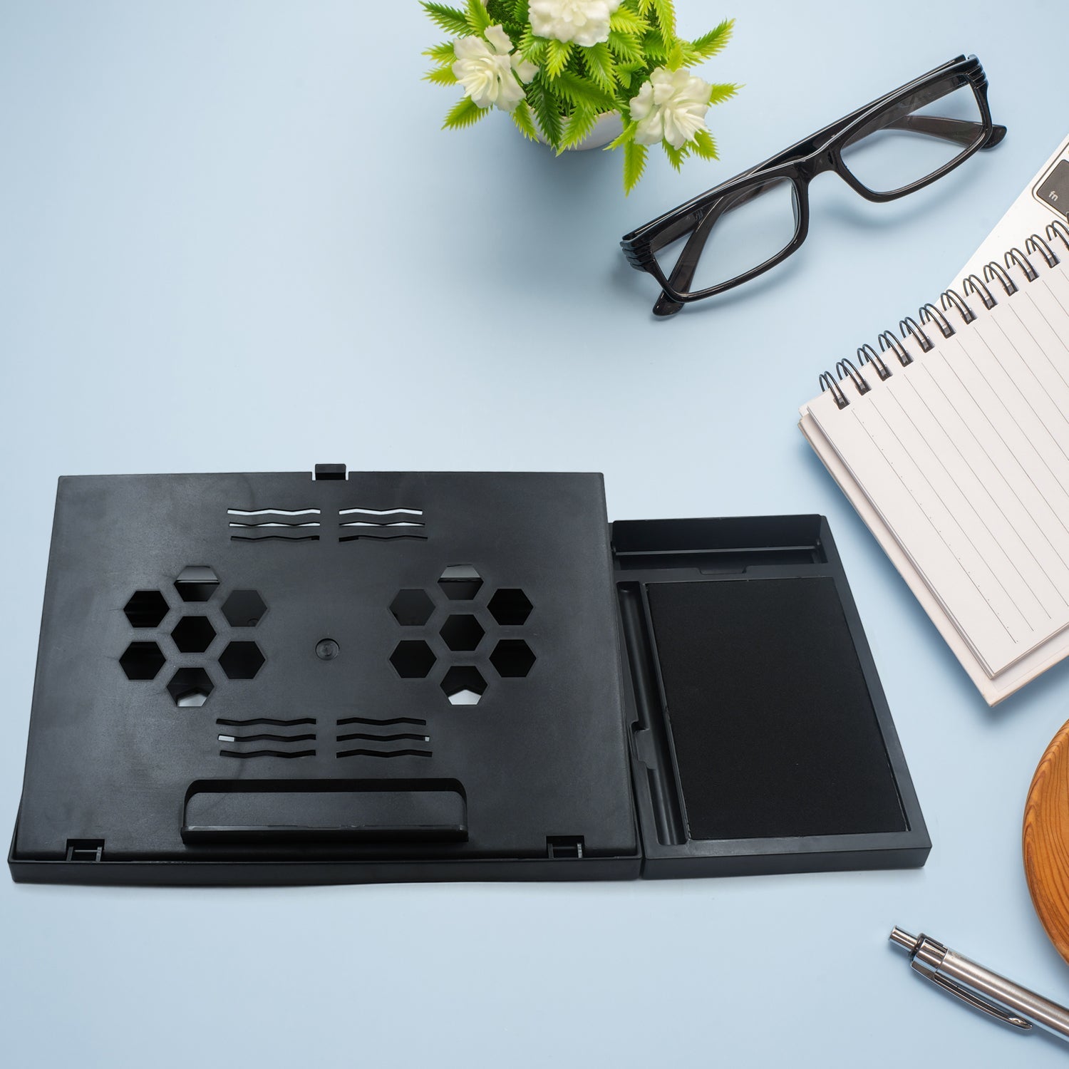 Detail of the ventilation design on the foldable laptop stand.