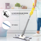 Close-up of the hands-free squeeze mechanism on the X-shape mop with a clean pad.