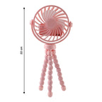 Portable fan mounted on flexible tripod stand in use outdoors
