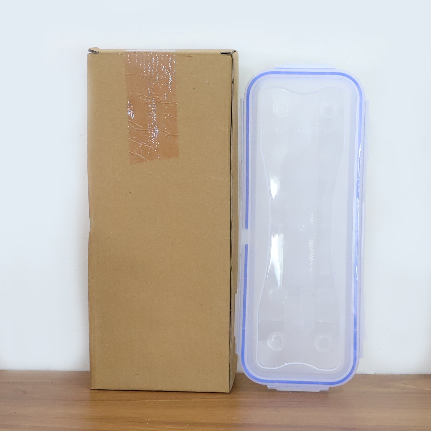 Transparent lock-clip egg storage box for fridge organisation.