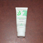 Zequz face wash tube with natural Neem and Tulsi leaves background