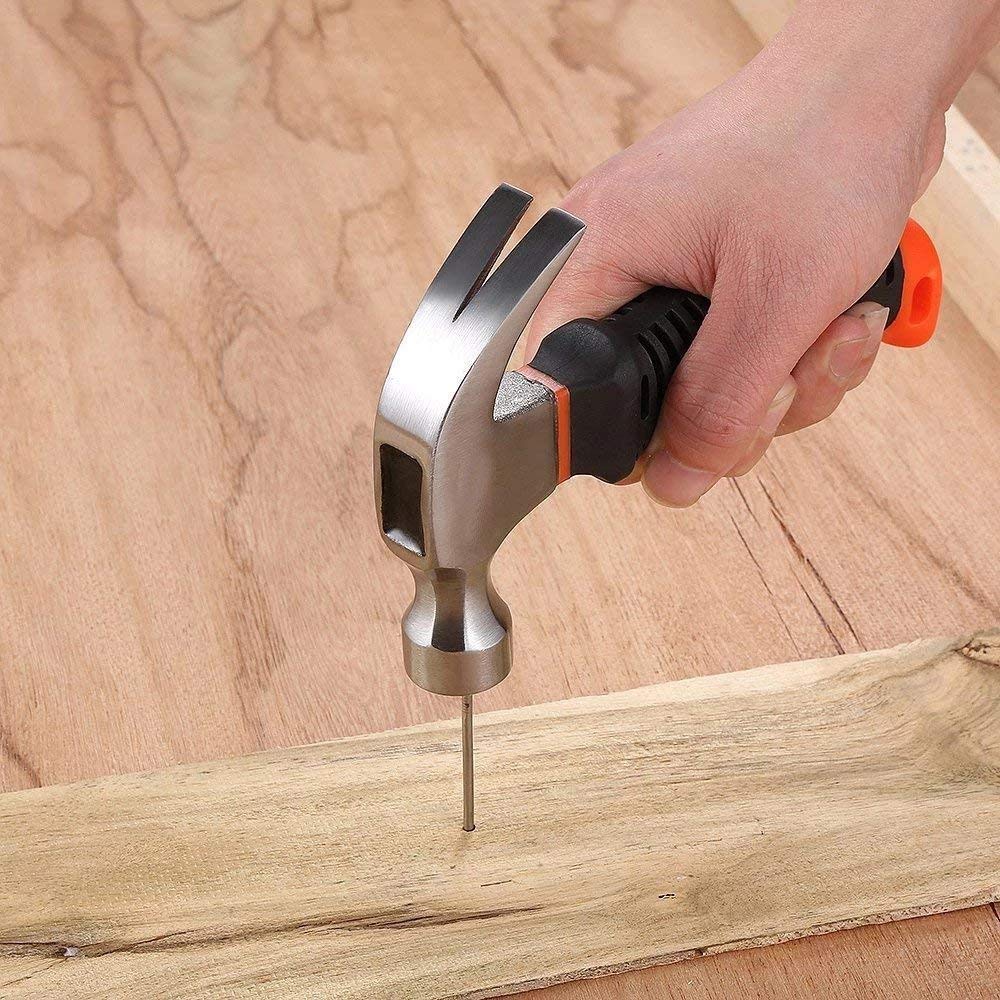 A hand holding the ergonomic plastic grip of the portable hammer, demonstrating comfort.