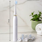 Close-up front view of electric toothbrush with ergonomic handle