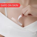 A female hand applying a clear fashion tape strip to secure a garment.