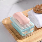 Portable detergent bar holder with a built-in roller brush, ideal for travel.