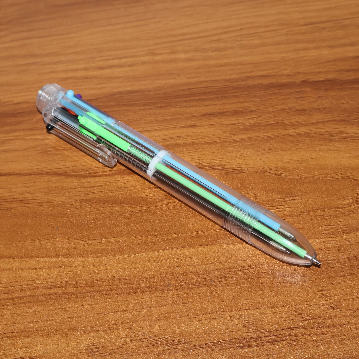 Compact multicolor ball pen designed for portability in pencil cases and bags.