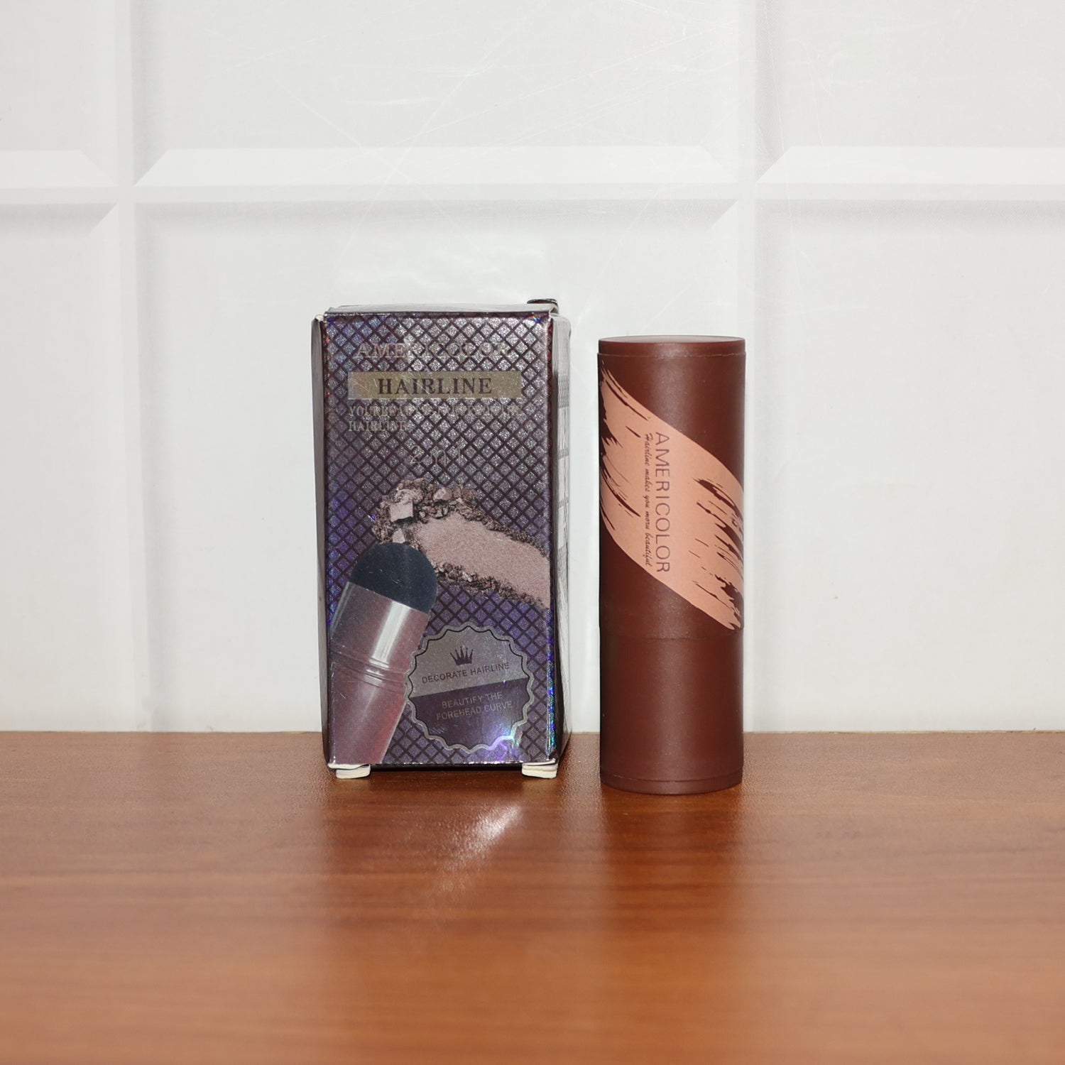 Hairline and eyebrow powder stick showcasing compact design and cushion puff