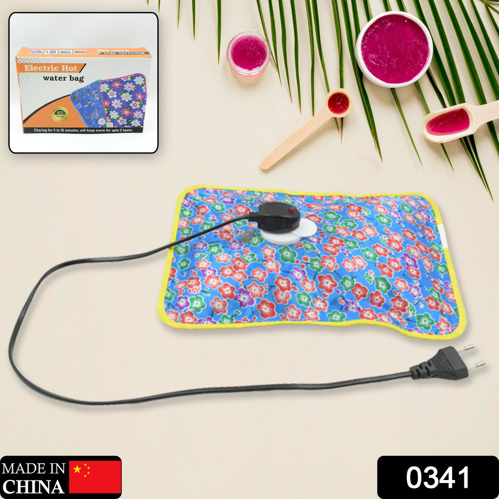 Rechargeable hot water bag plugged in for quick heating, showing the charging port.