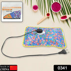 Rechargeable hot water bag plugged in for quick heating, showing the charging port.