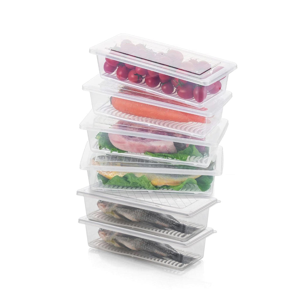 Fresh green vegetables stored neatly in an Organivo freezer container with a drain plate.