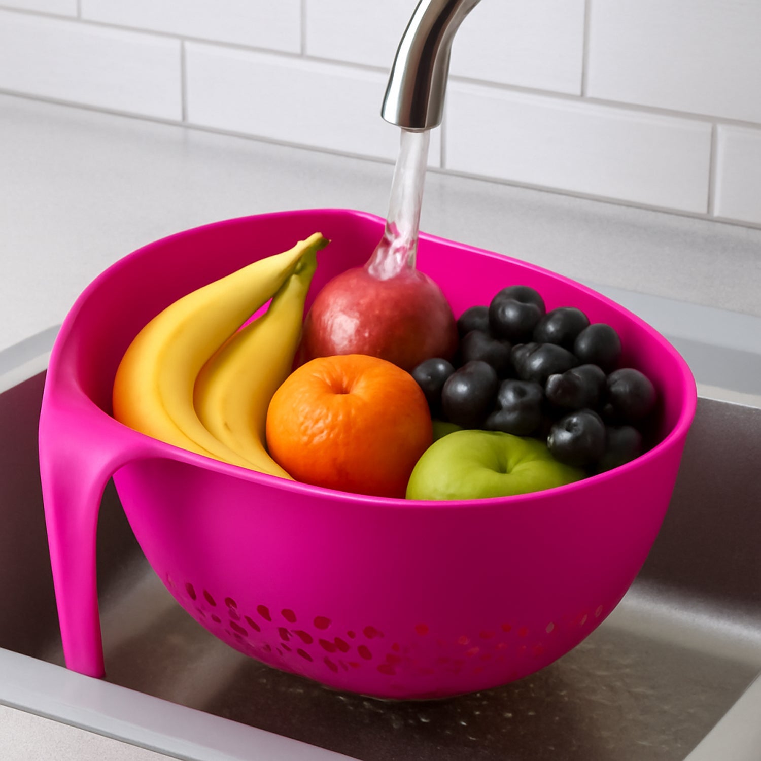 Close-up of ergonomic handle on triangular kitchen colander for comfortable grip