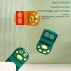 A scented toilet seat lifter positioned for easy, no-touch operation.