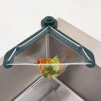 Poravar Kitchen Sink Filter Basket installed in a grey kitchen sink, catching food scraps.
