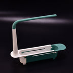 Expandable dish drying rack with a fresh sponge and brush, showcasing its adjustable feature over a sink.