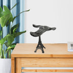 Side view of the Balancing Eagle Toy gracefully perched on its Eiffel Tower stand, demonstrating its perfect balance.
