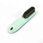 The versatile household scrubber shown with water, ready for deep cleaning.