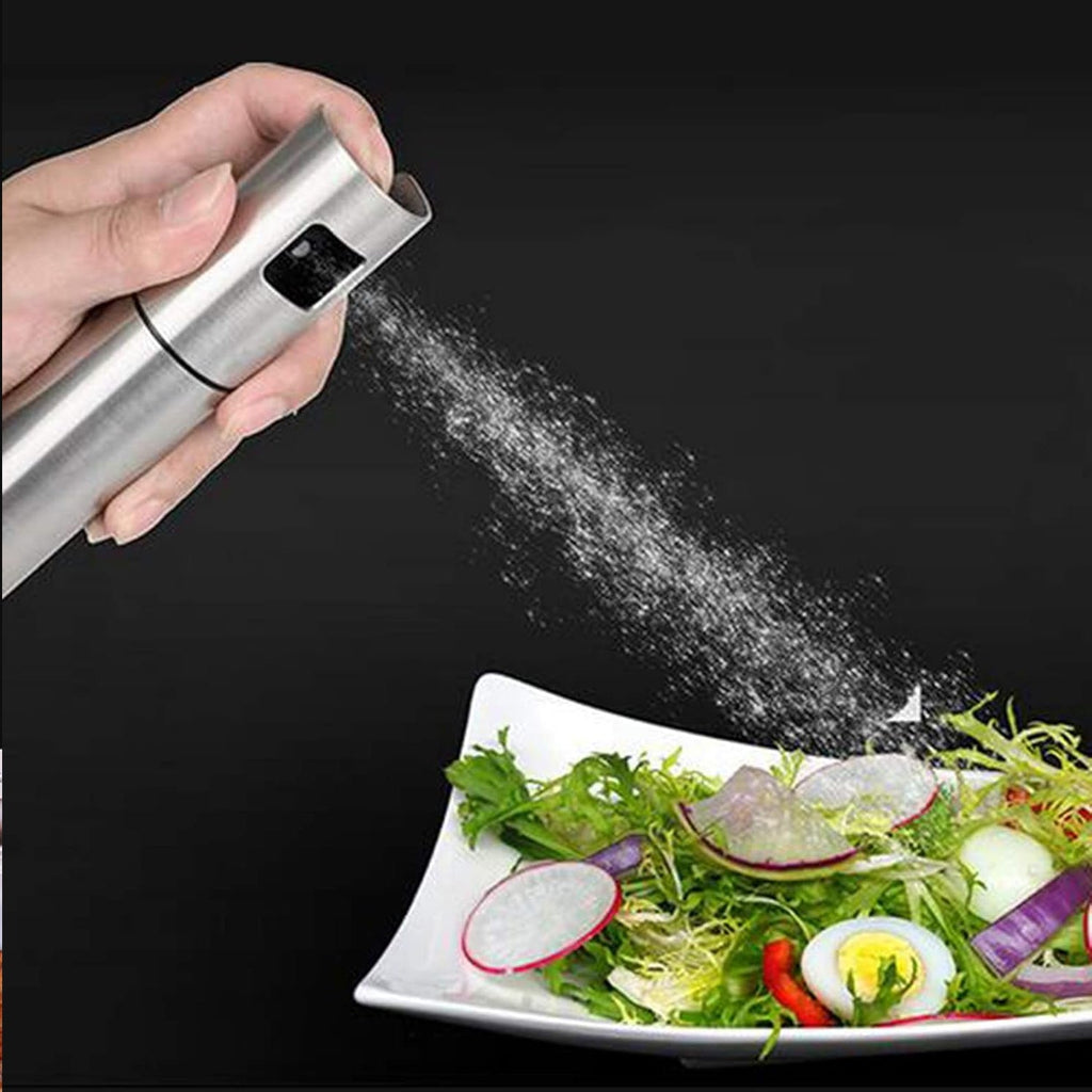 Ergonomic stainless steel oil dispenser for cooking and baking.