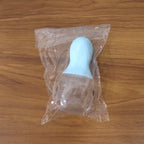 Pet food scoop and bag clip tool on light background
