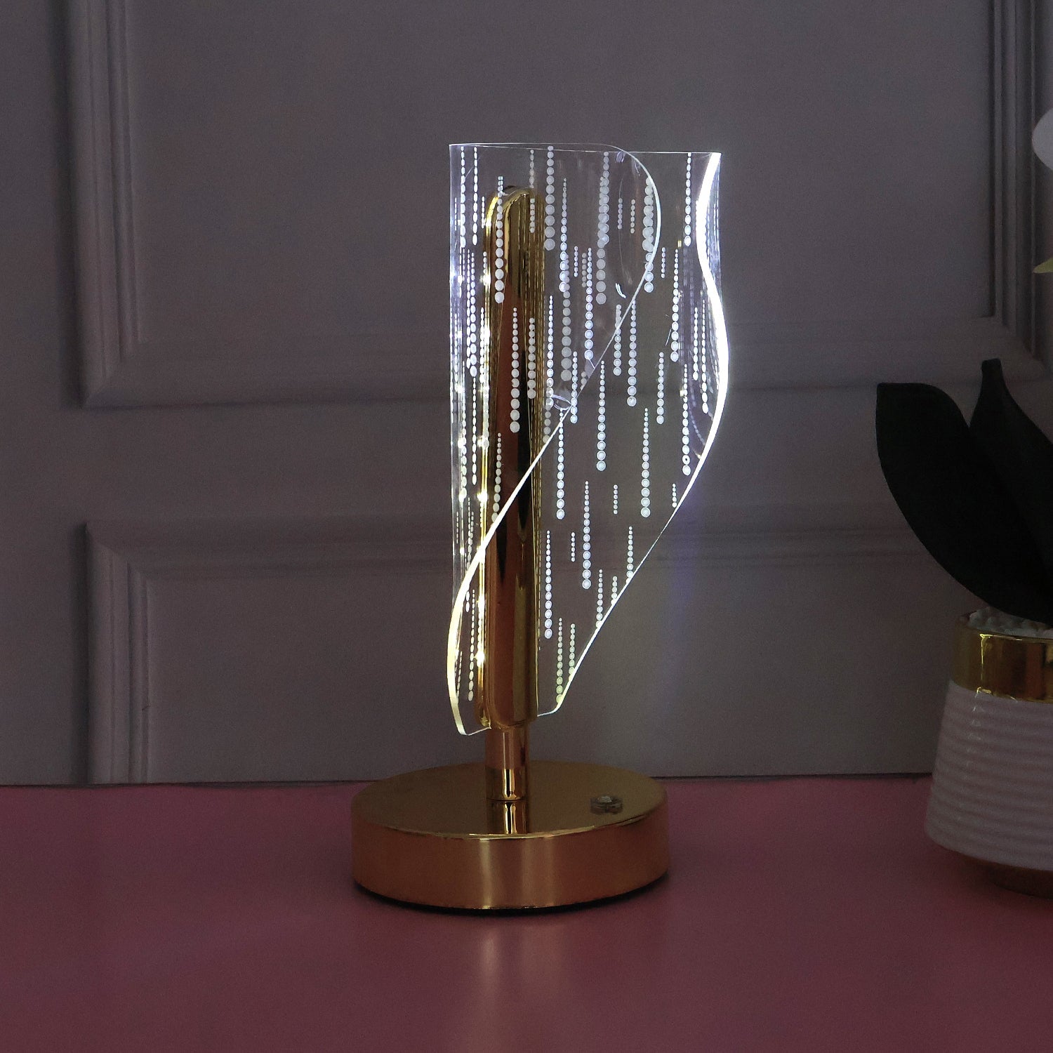 Close up of warm glowing crystal LED table lamp