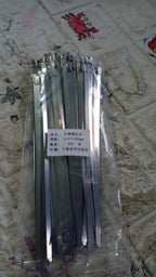 Versatile stainless steel cable ties shown in various applications, including automotive and industrial use.