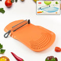 Cut 'n' Wash multipurpose cutting board with integrated strainer and stainless steel knife in kitchen