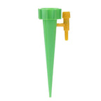 Hand demonstrating how to attach a bottle to the self-watering plant spike.