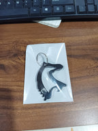 Angled view of metal horse face keychain accessory
