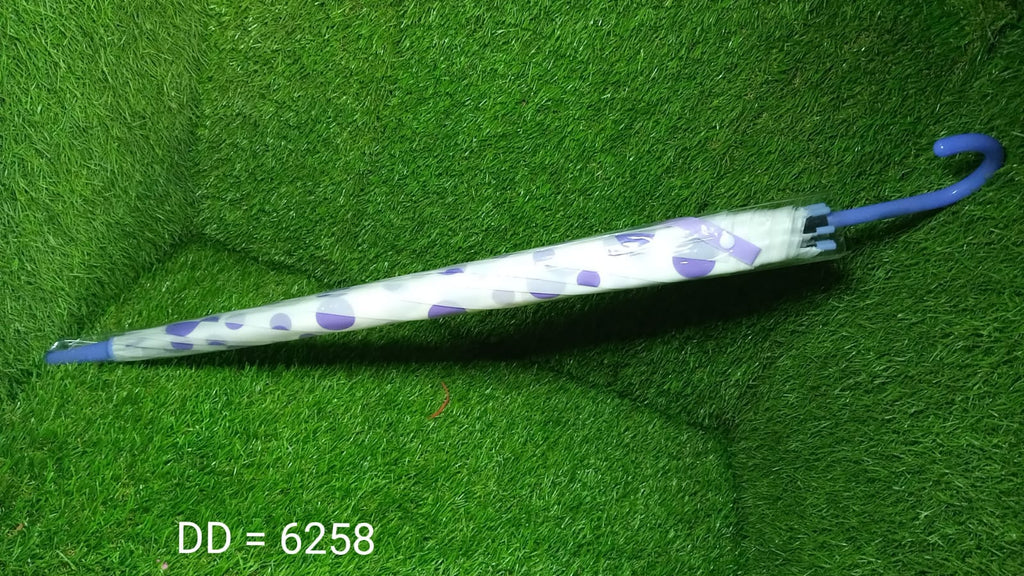 Another view of the elegant dot printed umbrella, highlighting its design.